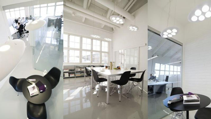 采用飞利浦时尚办公室照明的五角设计公司的办公室、会议室和休息区
