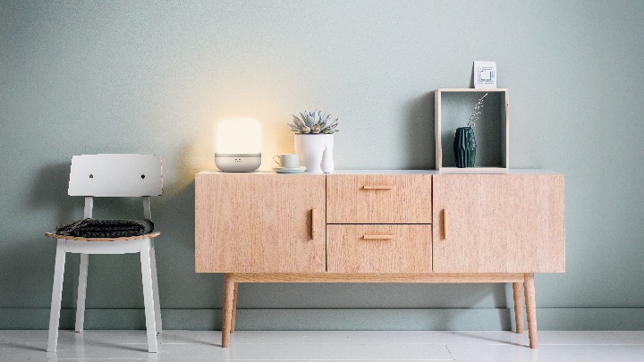 Table lamp lighting a living room cabinet
