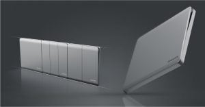 飞利浦现代电器面板系列展示了左侧三个独立的银灰色开关面板，每个面板布局不同，右侧一个较大的倾斜单面板，全部采用反光材质，呈现出简洁优雅的设计风格，背景为深灰色。